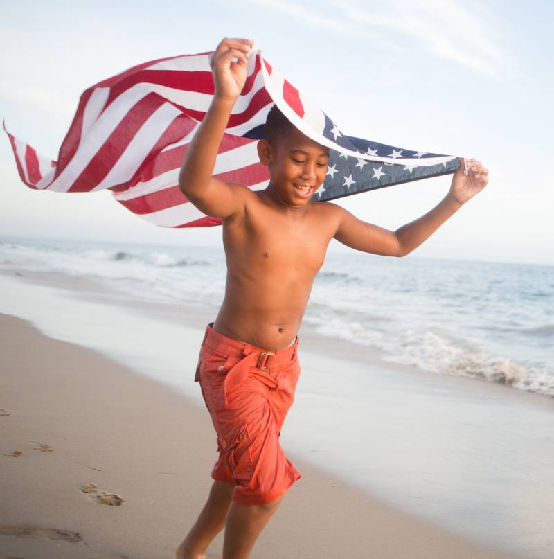 30A Memorial Day Weekend: Boy on Beach with USA Flag